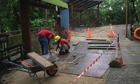Man and 2-year-old daughter fall through hole into raging waters at Sungei Buloh
