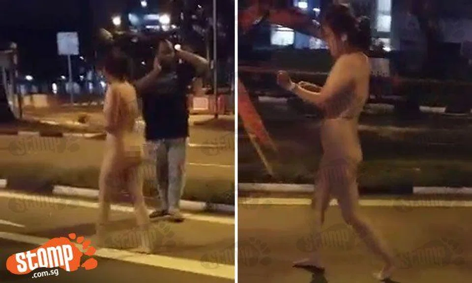 Naked woman walks on road at Upper Boon Keng -- as men desperately try to prevent her from getting knocked down by vehicles