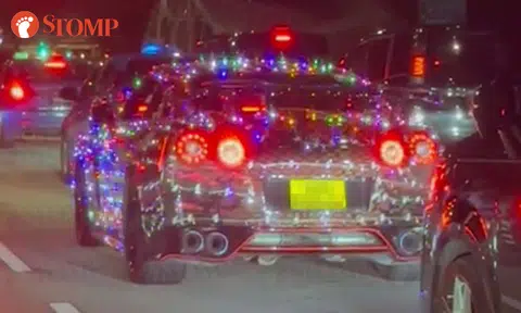Car decked out in flashing lights along Scotts Road is perfect for Christmas -- but is it legal?