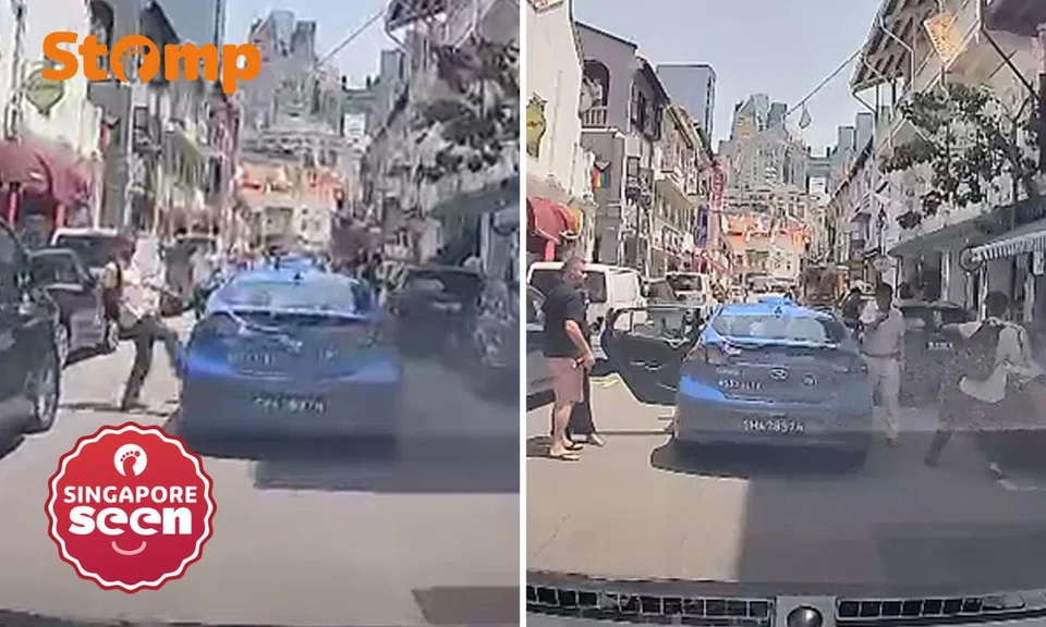 man kicks taxi at temple street