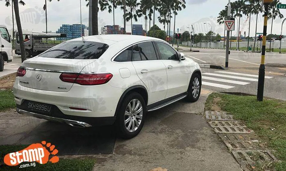 Double whammy for parking goondu who parks car on pavement and blocks zebra crossing