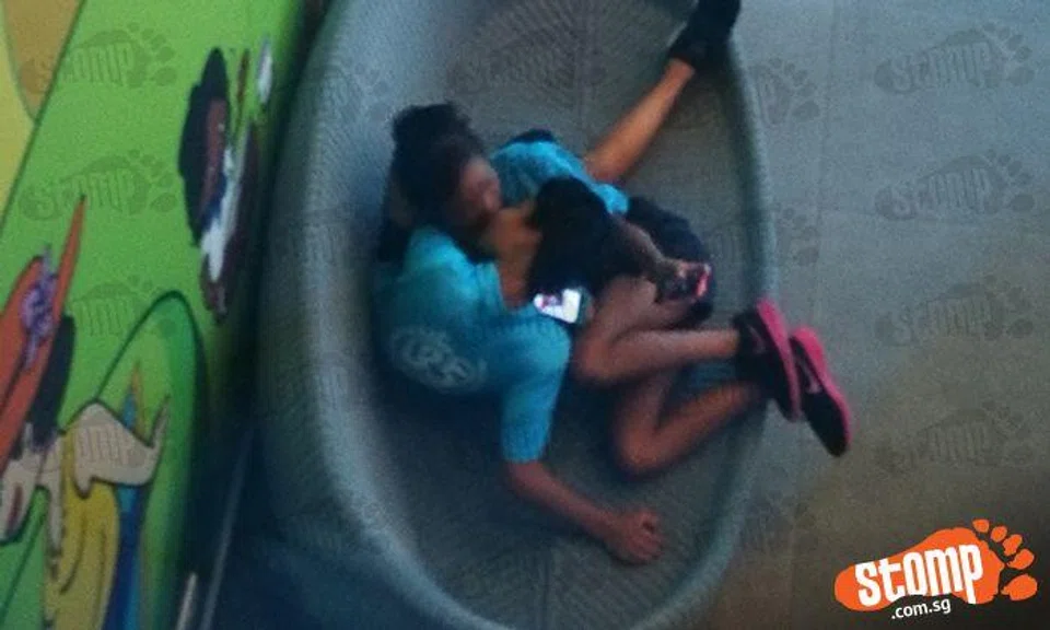 Young couple behaves intimately --- under watchful gazes at Woodlands Galaxy Community Club