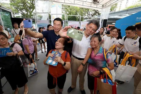 Education Minister Chan Chun Sing (right) and Senior Parliamentary Secretary for Culture, Community and Youth and Social and Family Development Eric Chua at the POSB “Support Our Heartlands” community event at Tiong Bahru Plaza on March 15.