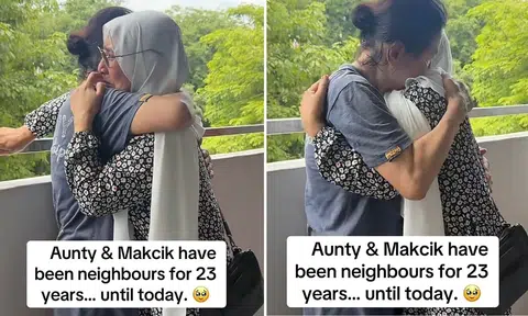 Chinese and Malay auntie locked in tearful embrace