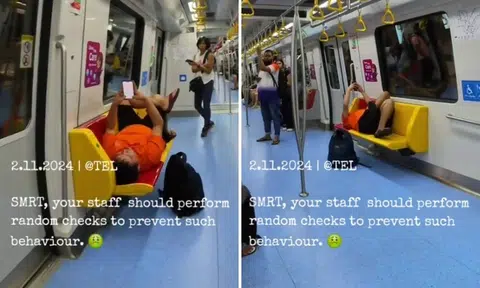 Man on train lies down across row of seats and looks at phone: Should passengers do something?