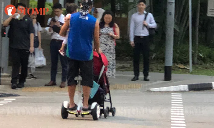 Multitasking man rides Segway -- while carrying baby and pushing pram ...