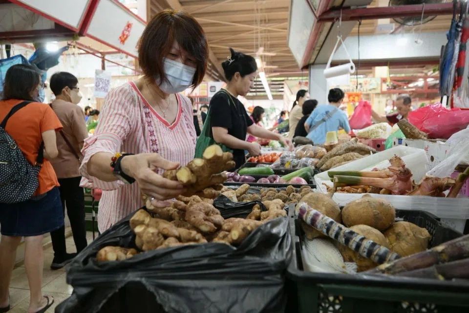 Madam Teo Siew Kee, a housewife, shopping for ingredients at Redhill wet market.