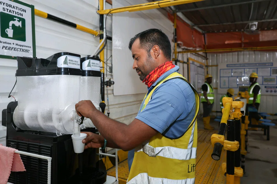 Vico Construction lifting supervisor Rakibujjaman Mohammad pouring himself an ice slushie at the Central Weave @ AMK construction site on April 4.
