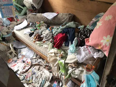 Wheelchair user lives in cluttered flat; mattress covered in faeces and maggots