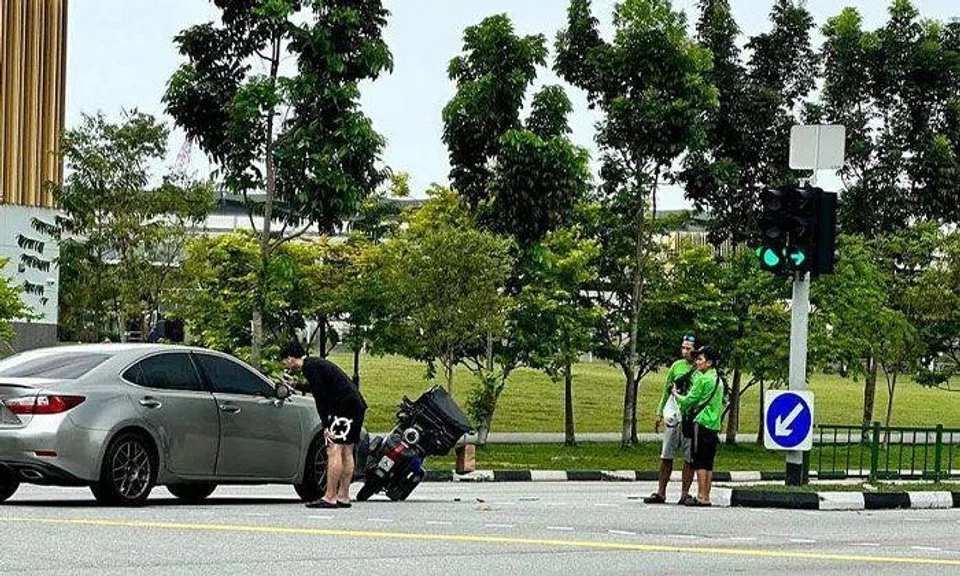 The 39-year-old driver of a car was slurring, walking unsteadily and had removed his shirt after exiting the vehicle. PHOTO: SHIN MIN DAILY NEWS READER