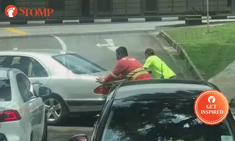 2 kind men help troubled driver push his car until it enters parking lot at Adam Road