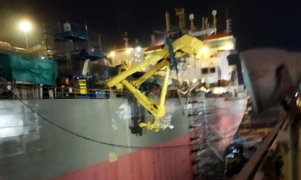 The workers were at work on a scaffold that was built around a structure atop the docked vessel at 51 Pioneer Sector 1. Photo: The Straits Times reader