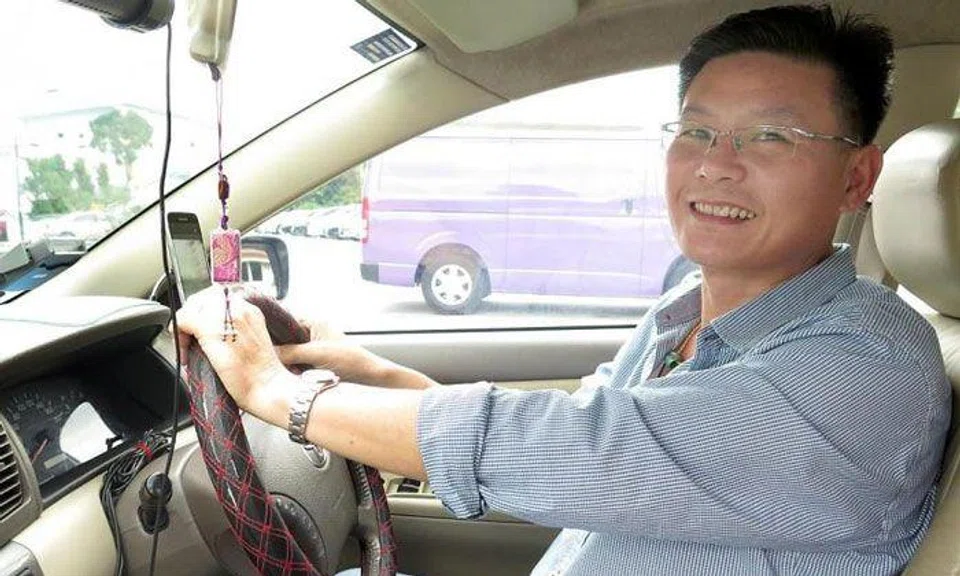 Mr Er Keh Joo has been driving for Grab for four years.TNP PHOTO: HARIZ BAHARUDIN