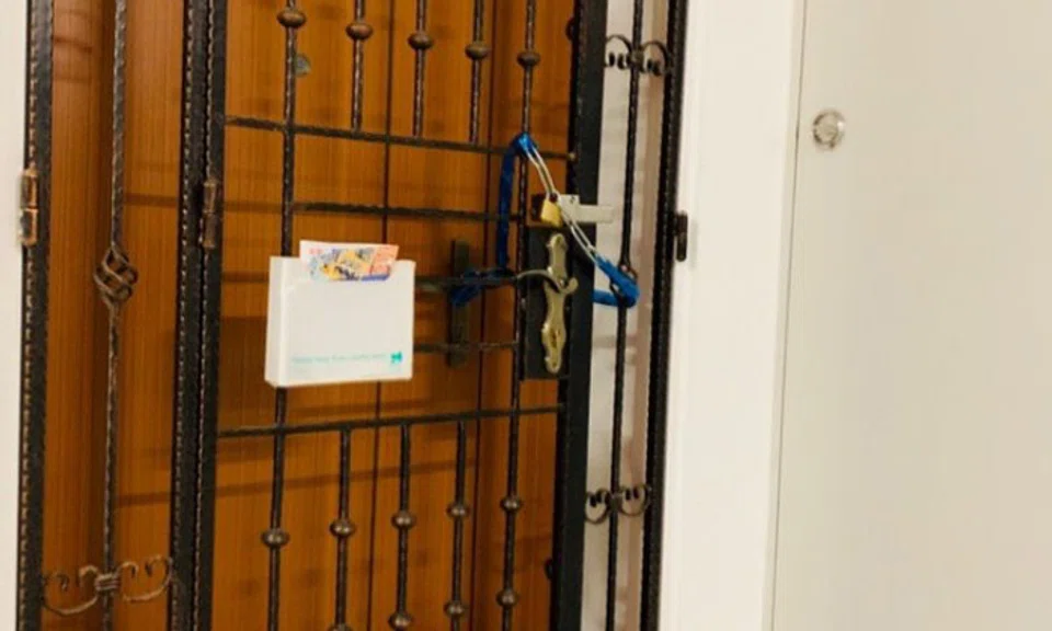 A photo of the door of the flat in Rivervale Crescent where a two-year-old child was found lying motionless in the bedroom. ST PHOTO: CHERYL TEH