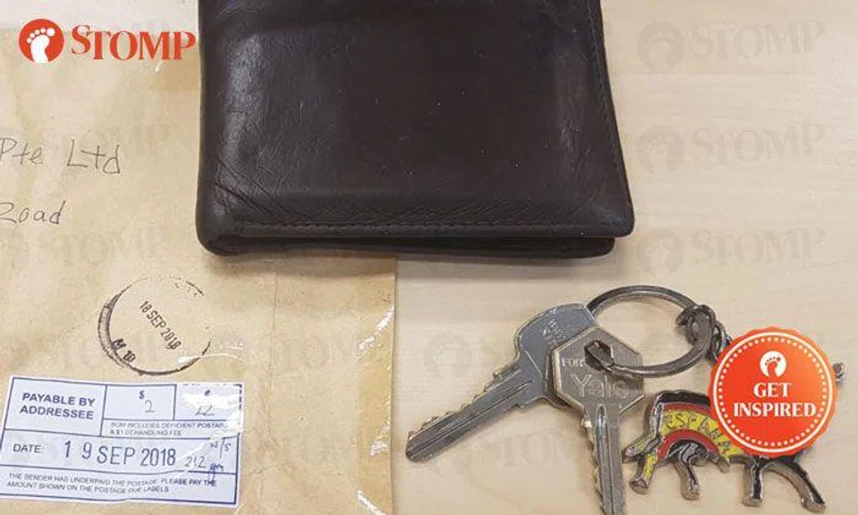 Thank you, kind soul who couriered lost wallet back to me -- but you left something behind!