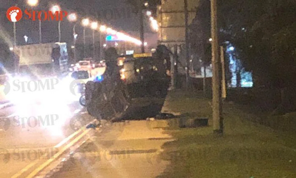 Female driver taken to hospital after car turns turtle near Yishun Dam