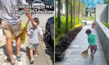 Toddler holding broom