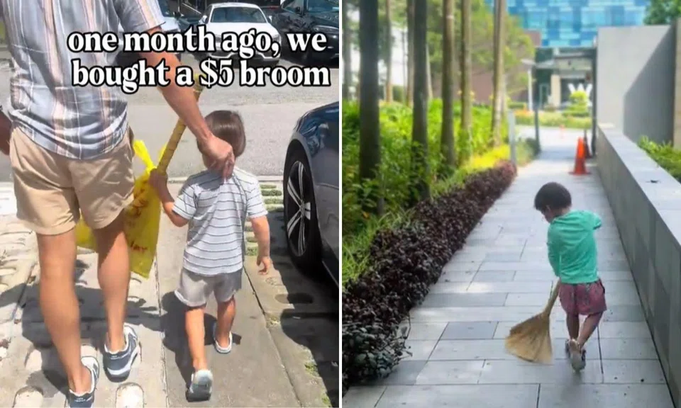 Toddler holding broom