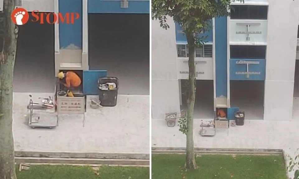 Is working in rubbish chute like this safe? 'If heavy items fall from high floor, helmet not enough to protect them'