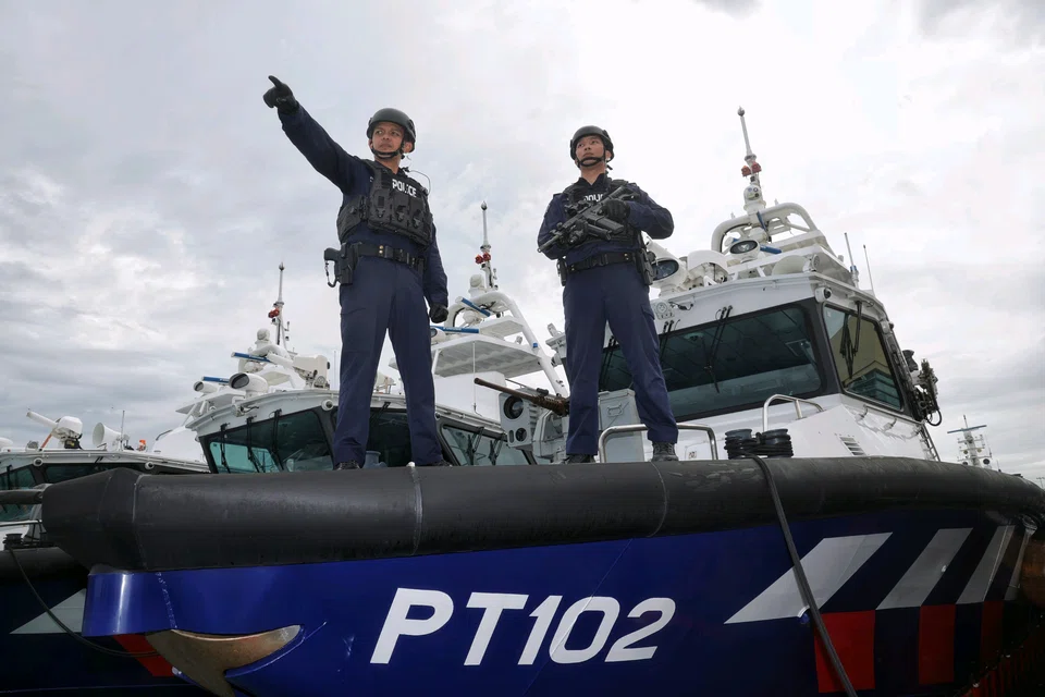 Inspector Muhammad Rasidi Suriade (left) and Sergeant Muhammad Zukhairie Khairudin of the Police Coast Guard.