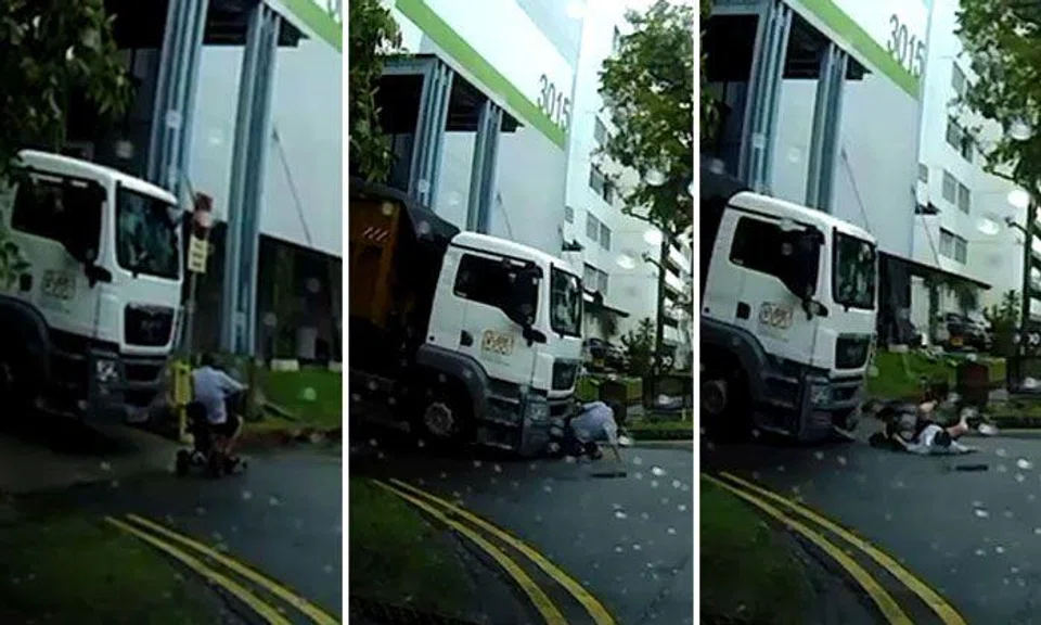 76-year-old PMD rider gets pinned under truck before falling to ground in Ubi