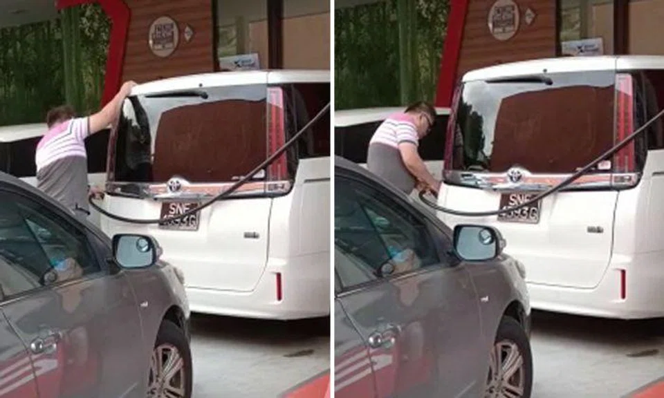 Man shakes car while pumping petrol in Bukit Timah -- but he might have good reason for it