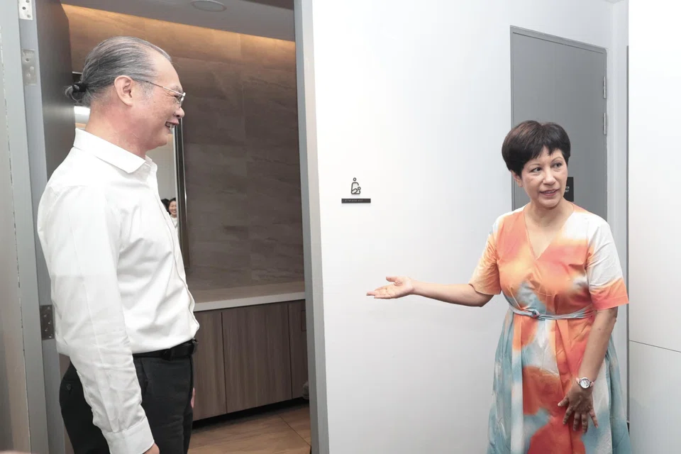 DCA Architects managing director Khoo Poh Bin and Second Minister for National Development Indranee Rajah at one of the 13 lactation rooms in new business park Elementum in one-north.