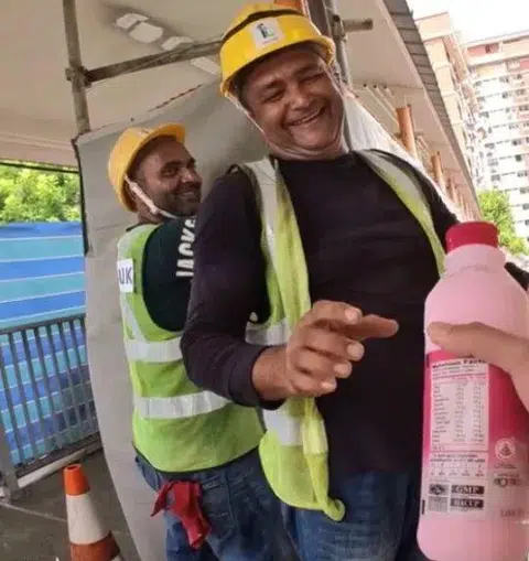 The man gave bottled milk to workers around Singapore.