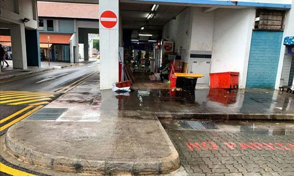 A refuse collection area near the coffee shop, where a man was seen falling to the ground during the scuffle in 2019. PHOTO: ST FIILE