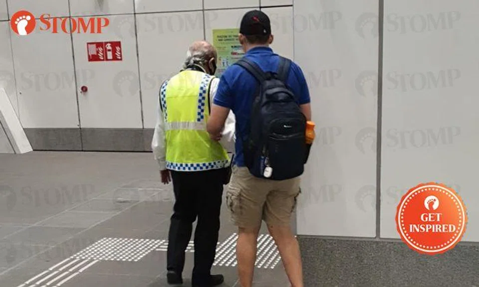 Security officer guides visually-impaired man, holds his hand all the way from MRT station to bus stop