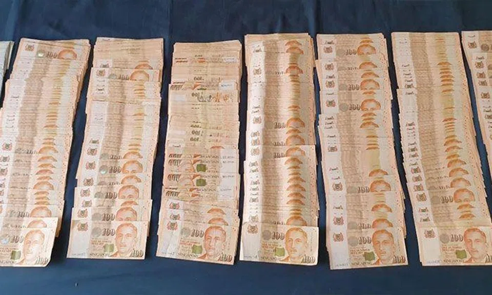 Suspected scam proceeds seized from the syndicate. PHOTO: SPF