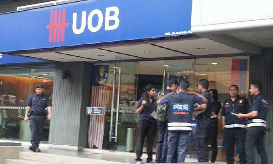 'Blur' security guard on duty unaware robber fled with $14k in KL bank heist