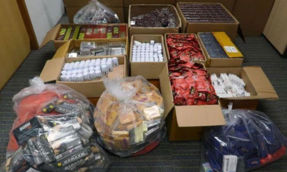 The haul included around 62,000 units of sexual enhancers that were stashed in drawers and cupboards. PHOTO: HSA