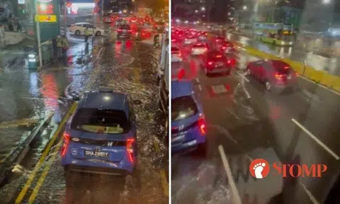 Taken from the upper deck of a double decker bus, the video shows vehicles splashing through the water and leaving a wake behind them.