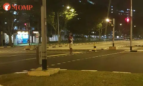What's this man doing taking selfies in the middle of the road at 4.40am?