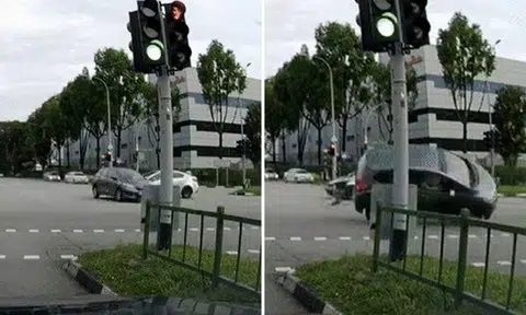 A video of the accident posted on Facebook shows a black car travelling straight through a traffic junction, when a light-coloured car collides with it. PHOTOS: SCREENGRAB FROM RAVEN QIU/FACEBOOK
