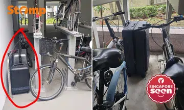 Suitcases locked to bicycle racks, turning Yishun void deck into 'luggage storage area'