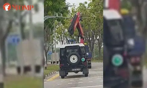 Lorry carrying heavy vehicle crashes into overhead traffic light along Tampines Link