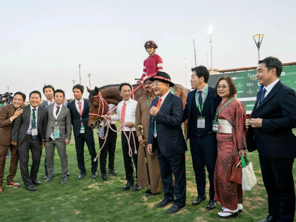 Trainer Yoshito Yahagi (in a hat) among the happy Japanese connections celebrating Forever Young's (Ryusei Sakai) victory in the Saudi Derby at the King Abdulaziz racecourse on Feb 24, 2024. 