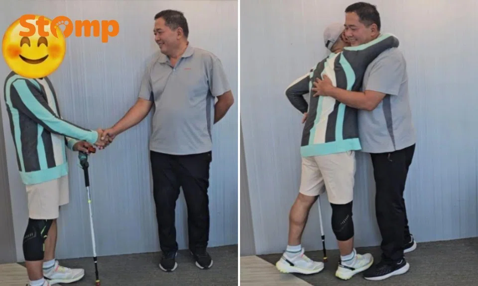 Two men hugging and shaking hands.