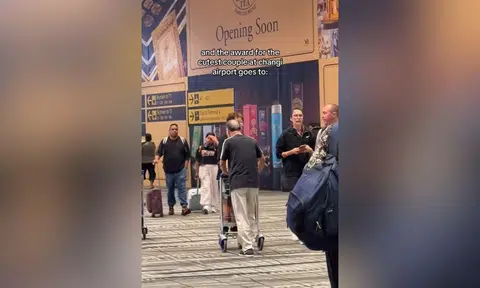 changi airport elderly couple luggage trolley 