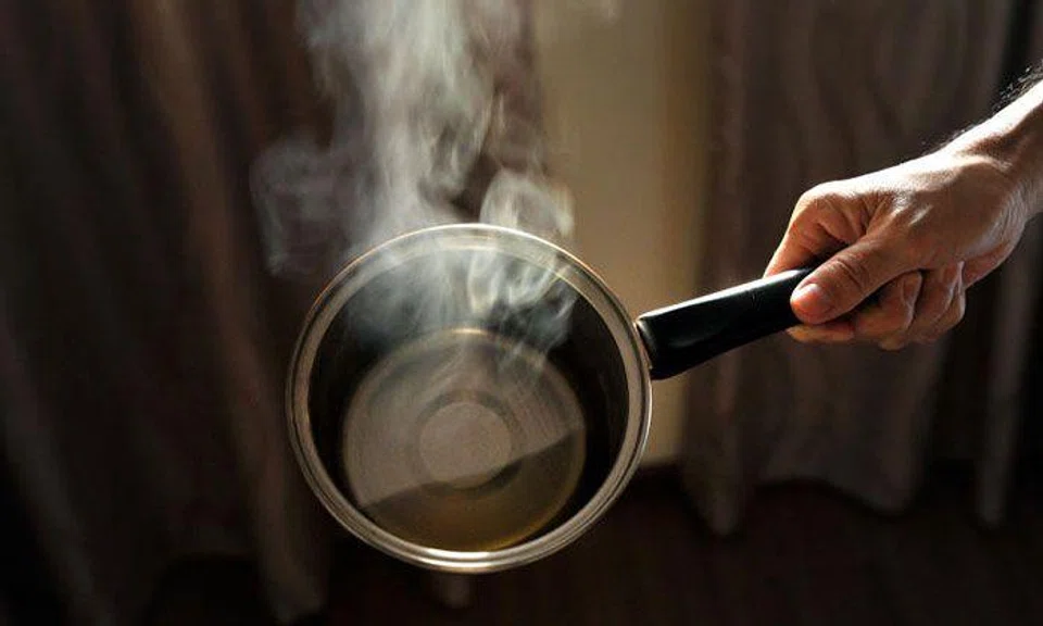 Divorced mother splashed hot water on her four children, aged 8 to 11, causing burns