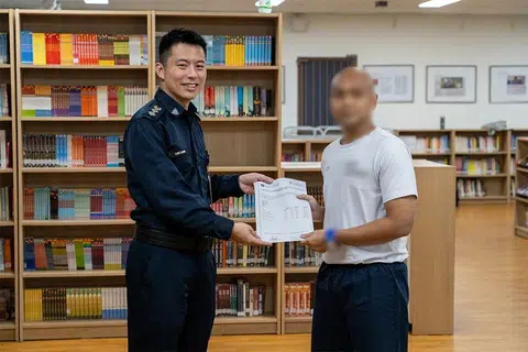 Nabil (not his real name) receiving his O-level results.