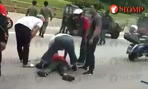 Man lies motionless while motorists tend to him on TPE