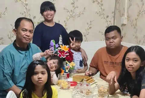 Mr Asman Abdullah with his six children.
