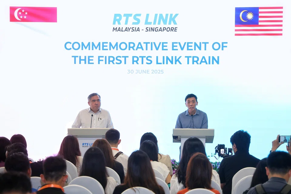 Acting Transport Minister Jeffrey Siow (right) and his Malaysian counterpart Anthony Loke speaking at SRTC on June 30.