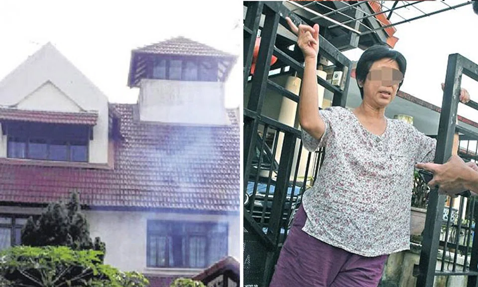 Madam Liu (right) said that the smoke from her home (left) was due to the barbecuing done in preparation for the Chinese New Year. Photo: Shin Min Daily News