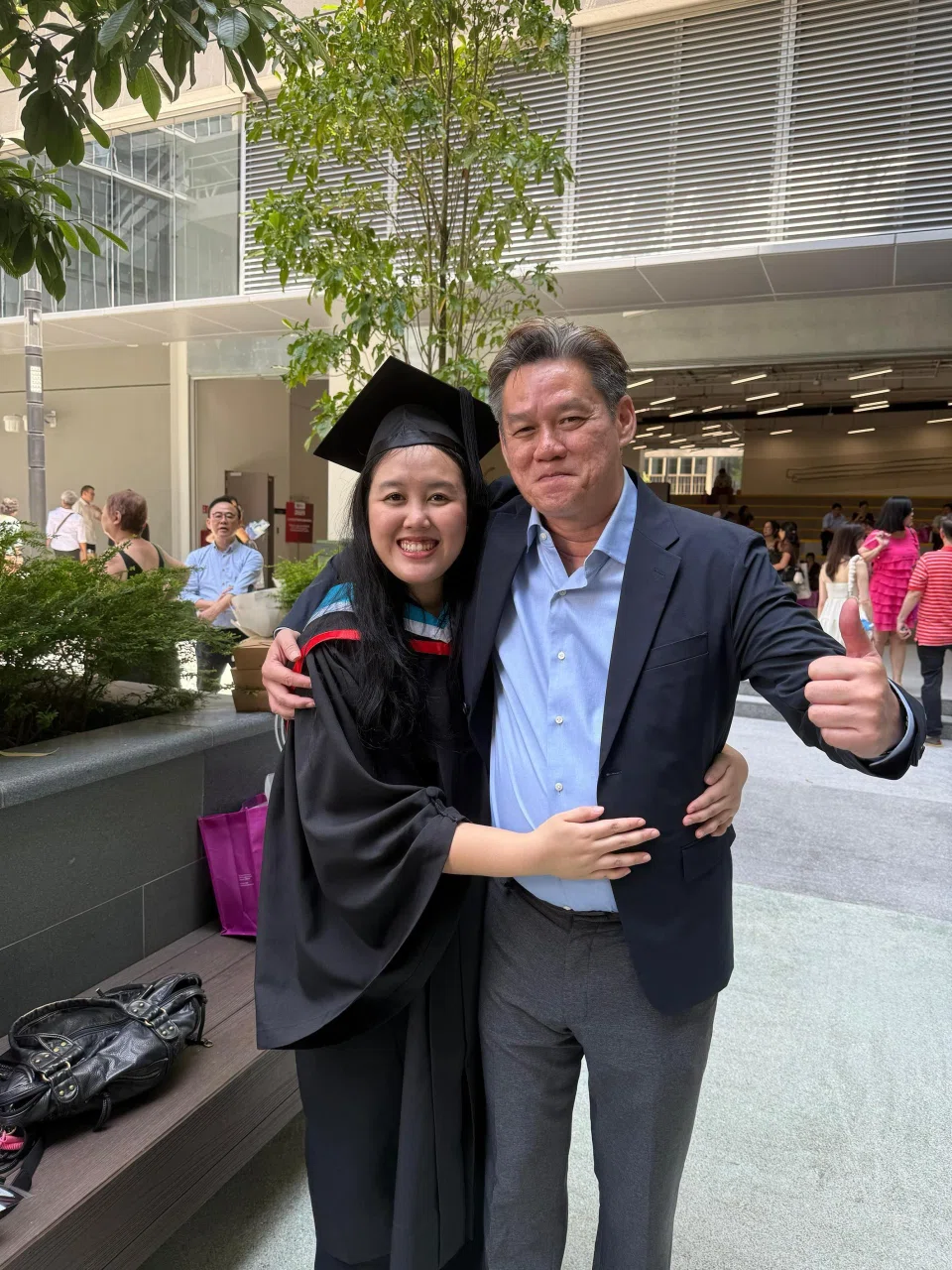 Ms Vinnie Tan with her father, Mr Theophilus Tan, when she graduated from the Singapore Institute of Technology in October 2025. PHOTO:COURTESY OF VINNIE TAN