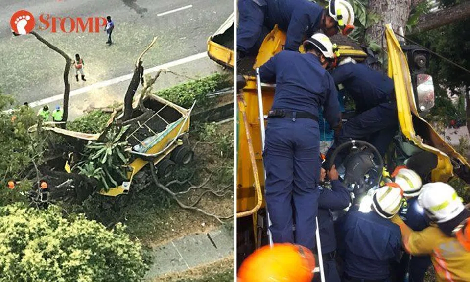 A lorry driver was trapped after hitting a tree along the ECP this morning (left). SCDF's DART officers rescued him using hydraulic rescue tools (right). PHOTOS: STOMP, SCDF