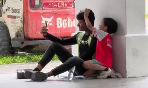 heartwarming moment between boy and migrant worker